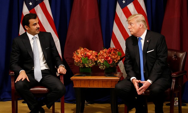 U.S. President Donald Trump meets with Qatar's Emir Sheikh Tamim bin Hamad al-Thani in New York, U.S., September 19, 2017. REUTERS/Kevin Lamarque