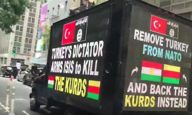 The van that carries supportive slogans to Kurds