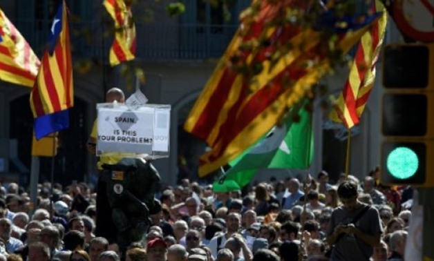 © AFP/File | Polls show that while Catalans are sharply divided on whether they want independence or not, a large majority would like to vote to settle the matter