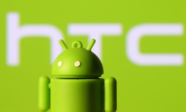 A 3D printed Android mascot Bugdroid is seen in front of an HTC logo in this illustration taken September 21, 2017. REUTERS/Dado Ruvic/Illustration