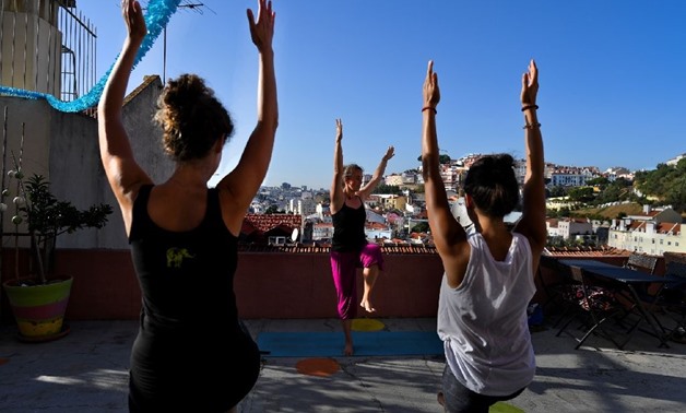 From hosting yoga classes to movie screenings, Lisbon's rooftops are being reclaimed (AFP Photo/)