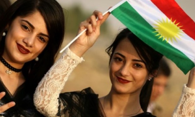 Iranian Kurdish girls take part in a rally to urge people to vote in next week's independence referendum in the Iraqi Kurdish region on September 21, 2017 - AFP