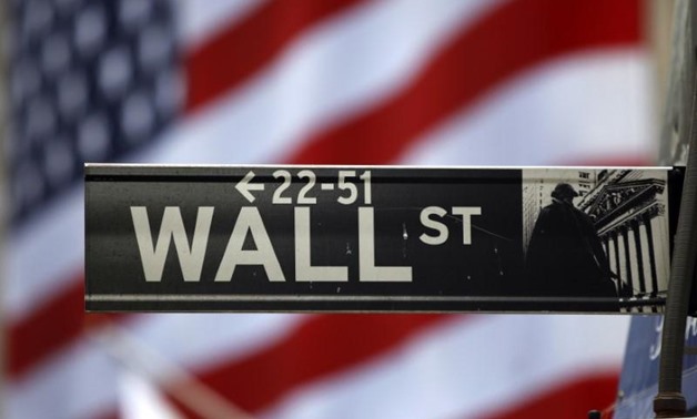 The Wall Street sign is seen outside the New York Stock Exchange, March 26, 2009. REUTERS/Chip East