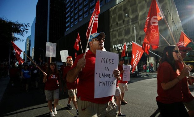 Members of Canada's Unifor union march during a rally ahead of the third round of NAFTA talks involving the United States, Mexico and Canada in Ottawa, Ontario, Canada, September 22, 2017. REUTERS/Chris Wattie