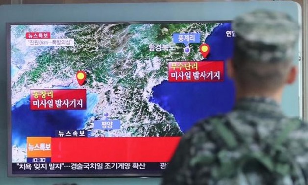 A South Korean soldier watches a TV broadcasting a news report on Seismic activity - Reuters
