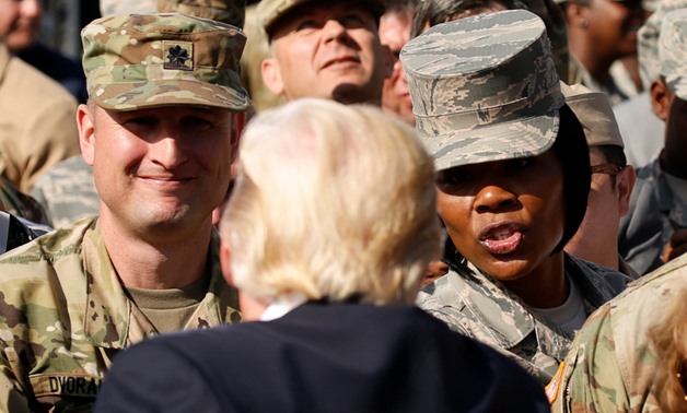 U.S. President Donald Trump greets military personnel while attending the 9/11 observance at the National 9/11 Pentagon Memorial in Arlington, Virginia, U.S., September 11, 2017. REUTERS/Kevin Lamarque