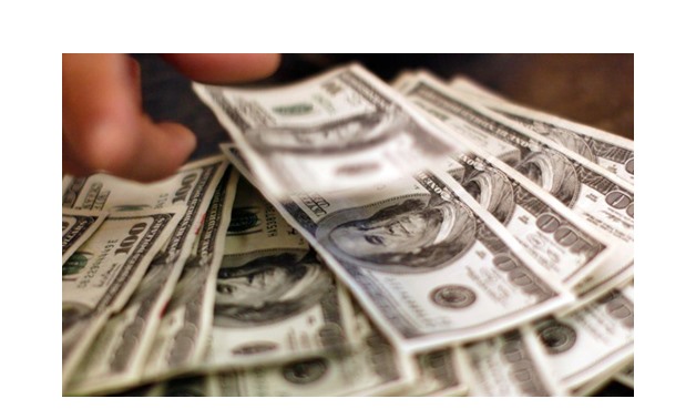 U.S. dollar banknotes – Reuters/Rick Wilking 
