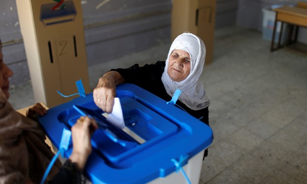 Woman casting her vote during Kurdistan's independence referendum held in September 2017 - Reuters