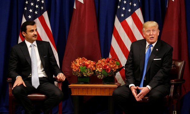 U.S. President Donald Trump meets with Qatar's Emir Sheikh Tamim bin Hamad al-Thani in New York, U.S., September 19, 2017. REUTERS/Kevin Lamarque

