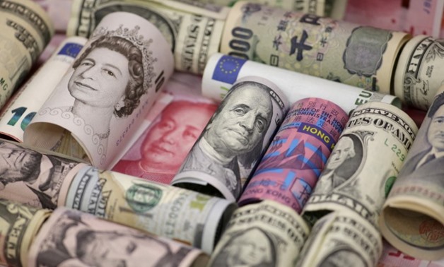 Euro, Hong Kong dollar, U.S. dollar, Japanese yen, British pound and Chinese 100-yuan banknotes are seen in a picture illustration shot January 21, 2016. REUTERS/Jason Lee/Illustration/File Photo