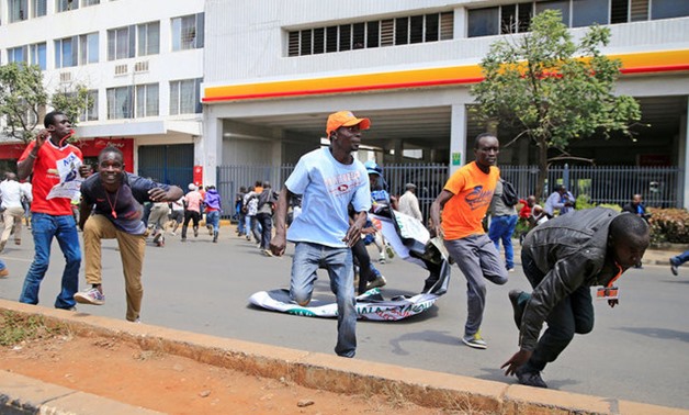  Supporters of the opposition National Super Alliance (NASA) coalition run after riot policemen dispersed protesters during a demonstration calling for removal of Independent Electoral and Boundaries Commission (IEBC) officials in Nairobi, Kenya September