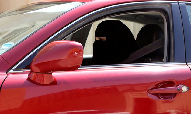 A woman drives a car in Riyadh Saudi Arabia - REUTERS