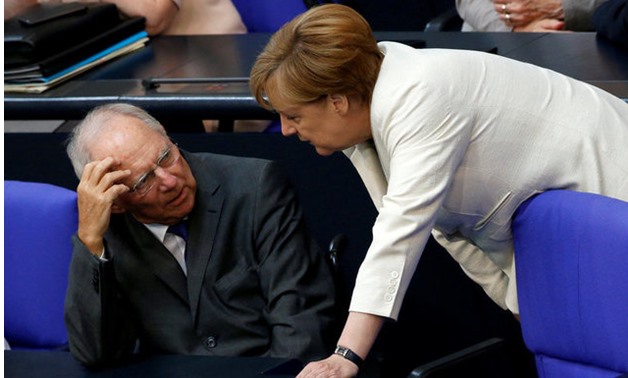 German Finance Minister Schaeuble listens to Chancellor Merkel as they attend a debate on the consequences of the Brexit vote at the lower house of parliament Bundestag in Berlin - REUTERS