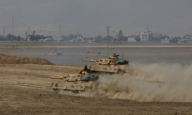 Turkish tanks maneuver during a military exercise near the Turkish-Iraqi border in Silopi - REUTERS