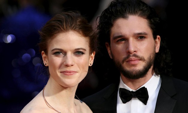 FILE PHOTO - Actor Kit Harington (R) and actress Rose Leslie (L) pose for photographers as they arrive at the Olivier Awards at the Royal Opera House in London, Britain April 3, 2016. REUTERS/Neil Hall/File Picture