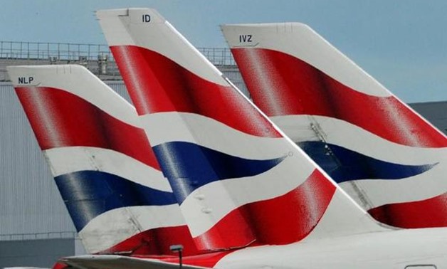 British Airways logos are seen on tailfins at Heathrow Airport in west London, Britain May 12, 2011. REUTERS