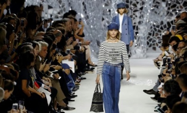 A Breton jumper with the slogan "Why Have There Been No Great Women Artists?" led Dior's spring-summer collection at Paris Fashion Week - AFP/FRANCOIS GUILLOT