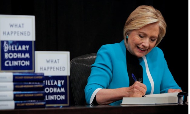 Former Secretary of State Hillary Clinton signs a copy of her new book 'What happened' at Barnes & Noble bookstore at Union Square in Manhattan, New York City, U.S., September 12, 2017. REUTERS/Andrew Kelly