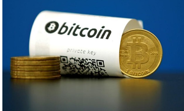  A Bitcoin (virtual currency) paper wallet with QR codes and a coin are seen in an illustration picture taken at La Maison du Bitcoin in Paris, France May 27, 2015. REUTERS/Benoit Tessier