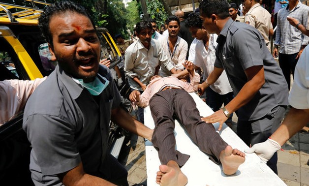 A stampede victim is carried on a stretcher at a hospital in Mumbai - REUTERS