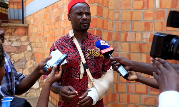 An Ugandan lawmaker Mbwatekamwa Gaffa injured during a fight in the parliament on Wednesday ahead of proposed age limit amendment bill debate, speaks to the media, in Kampala - REUTERS