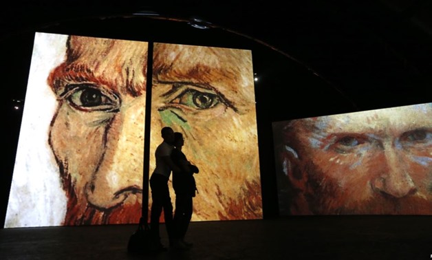  People visit the Van Gogh Alive exhibition in St. Petersburg, Sept. 11, 2014. -REUTERS
