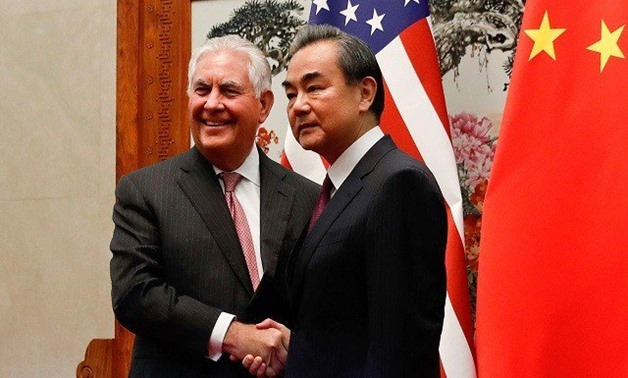 US Secretary of State Rex Tillerson (L) shakes hands with Chinese Foreign Minister Wang Yi before a meeting at the Great Hall of the People in Beijing on September 30, 2017. Tillerson met with China's foreign minister in Beijing on September 30 to discuss