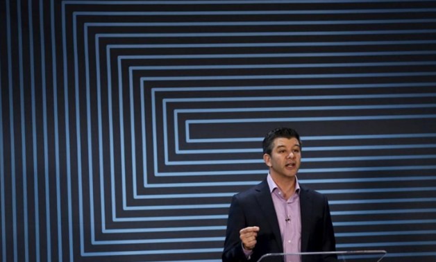 Uber CEO Travis Kalanick gestures as he delivers an address to employees and drivers marking the company's five year anniversary in San Francisco, California June 3, 2015. REUTERS/Robert Galbraith
