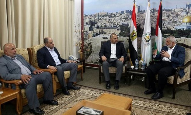 Hamas chief Ismail Haniya (R) meets members of the Egyptian delegation in Gaza - AFP