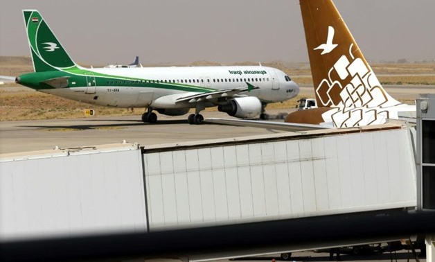 An Iraqi Airways plane sits on the tarmac at Arbil airport in Iraqi Kurdistan on September 28, ahead of a suspension of international flights out of the autonomous region over a controversial independence vote