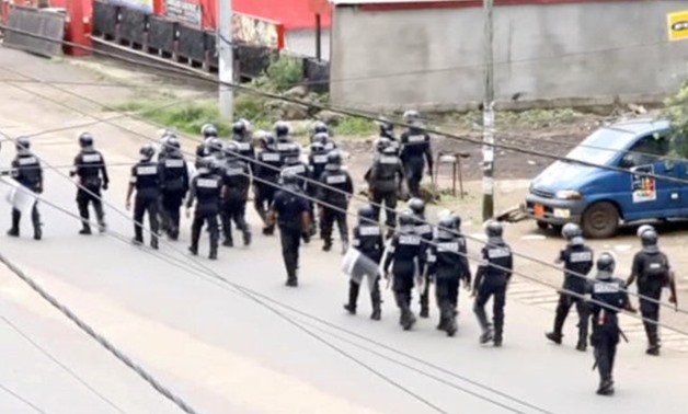 A still image taken from a video shows riot police walk along a street in the English-speaking city of Buea, Cameroon October 1, 2017. via REUTERS TV/File Photo