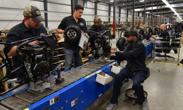 Workers construct mini-bikes at motorcycle and go-kart maker Monster Moto in Ruston, Louisiana January 25, 2017. Picture taken January 25, 2017. REUTERS/Nick Carey