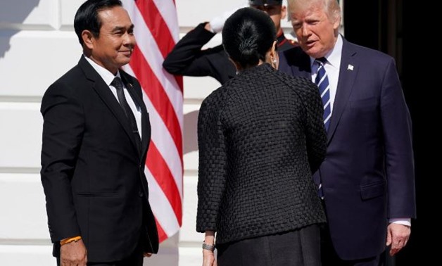 U.S. President Donald Trump greets Thai Prime Minister Prayut Chan-o-Cha and his wife Naraporn Chan-o-Cha at the White House in Washington, U.S., October 2, 2017. REUTERS/Joshua Roberts
