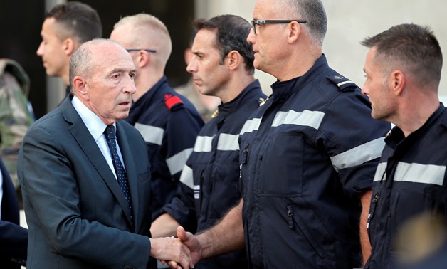 French Interior Minister Gerard Collomb meets with firemen outside the Saint-Charles train station after French soldiers shot and killed a man who stabbed two women to death at the main train station in Marseille, France, October 1, 2017. REUTERS/Jean-Pau
