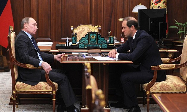  Russian Industry and Trade Minister Denis Manturov with Russian president Vladimir Putin- Photo courtesy of Russian presidency