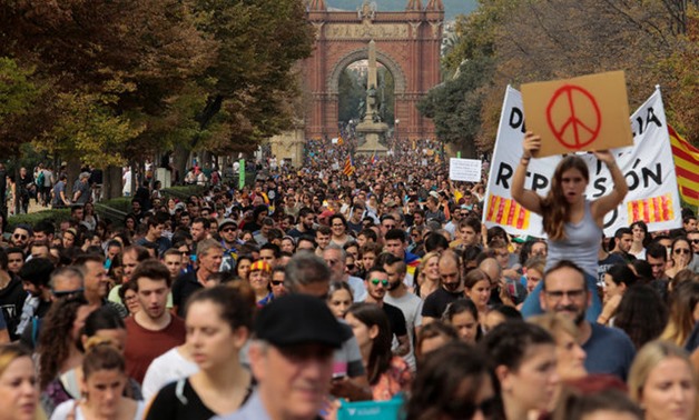 People walk during a demonstration two days after the banned independence referendum in Barcelona -  REUTERS