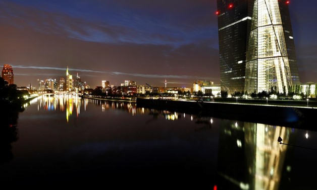 The skyline, with its characteristic banking towers and the headquarters of the European Central Bank (ECB, R), are reflected in river Main in Frankfurt, Germany, ctober 1, 2017. REUTERS/Kai Pfaffenbach