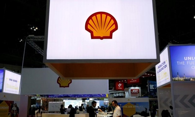Staff members work at the booth of Royal Dutch Shell at Gastech, the world's biggest expo for the gas industry, in Chiba, Japan, April 4, 2017. REUTERS/Toru Hanai