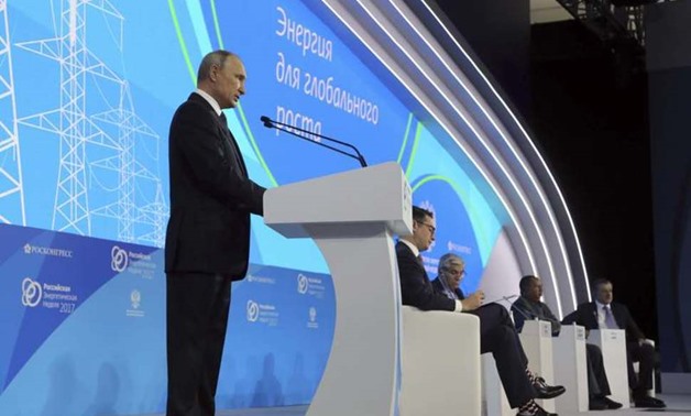 Russian President Vladimir Putin (front) delivers a speech at the Russian Energy Week 2017 forum in Moscow, Russia October 4, 2017. Sputnik/Mikhail Klimentyev/Kremlin via REUTERS Reuters