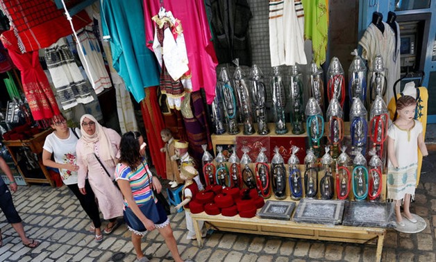 Algerian tourists are seen shopping at the old medina in Sousse - REUTERS
