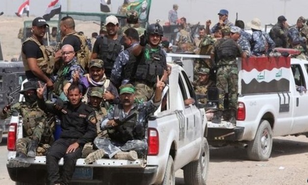 Iraqi troops and militiamen are reportedly positioned east, north and south of Ramadi - AFP