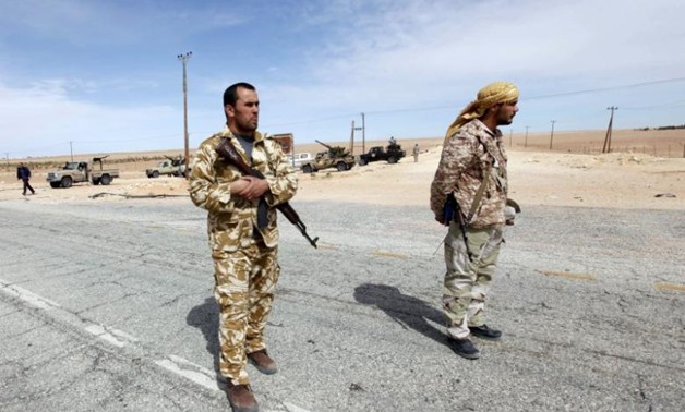 Libyan soldiers man a checkpoint in Wadi Bey, west of the Islamic State-held- Reuters