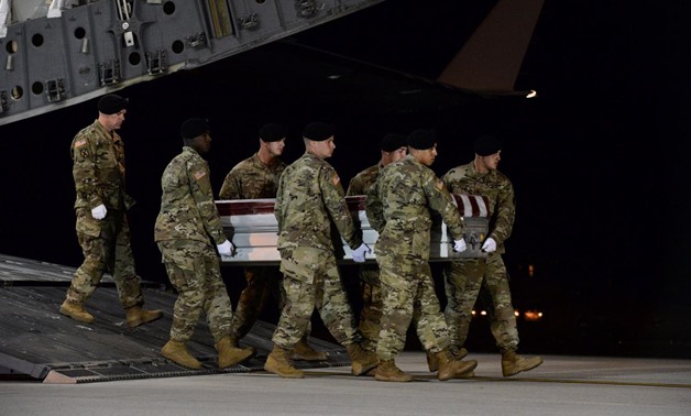 A U.S. Army carry team transfers the remains of Army Staff Sgt. Dustin Wright of Lyons, Georgia, at Dover Air Force Base in Delaware, U.S. on October 5, 2017. Courtesy Aaron J. Jenne/U.S. Air Force/Handout via REUTERS
