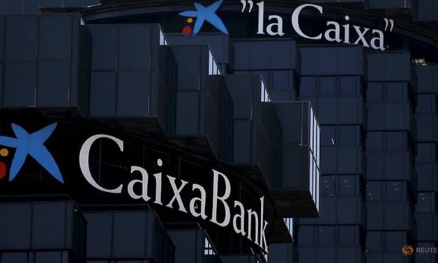 CaixaBank and LaCaixa's logos are seen at the company's headquarters in Barcelona, Spain, April 18, 2016. REUTERS/Albert Gea