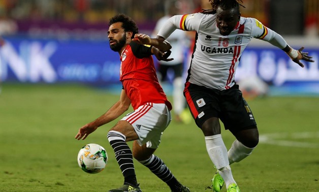 Uganda's Hassan Wasswa in action with Egypt's Mohamed Salah – REUTERS