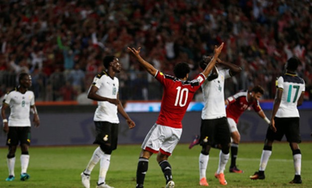 Mohamed Salah with Ghana players in their last match at Borg El Arab Stadium, REUTERS