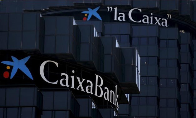 CaixaBank and LaCaixa's logos are seen at the company's headquarters in Barcelona, Spain, April 18, 2016 - REUTERS/Albert Gea