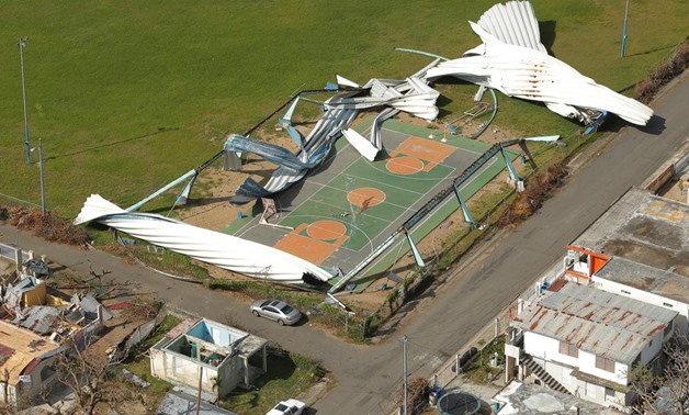 Remains of a shed is scattered over a basketball court after Hurricane Maria near Loiza, Puerto Rico, October 6, 2017. REUTERS/Lucas Jackson