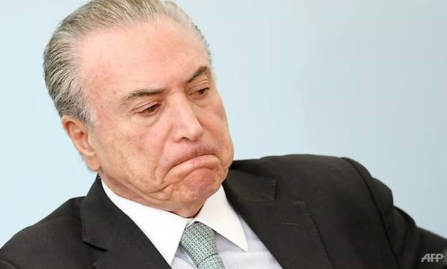 A recent poll found the center-right government of President Michel Temer, pictured here, is seen as doing a good or very good job by only three percent of the population. - AFP