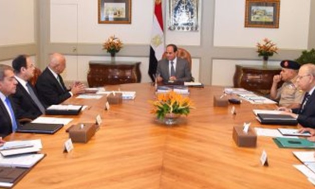 Photo of officials and Al-Sisi in the meeting photo File